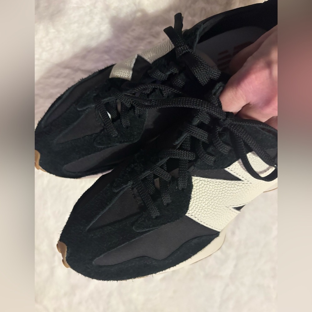 New Balance Women’s Black and White Athletic Sneakers with Gum Accents